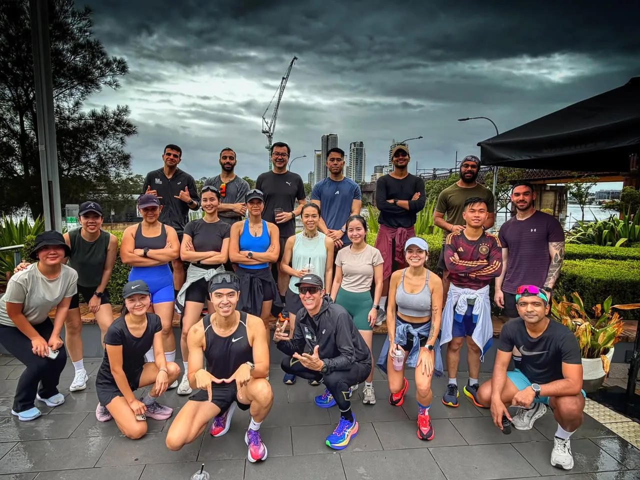 Meadowbank Run Club members gathered together on the waterfront after a run