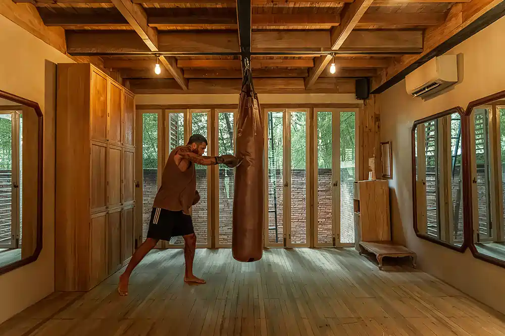 Boxing room at Balquisse Heritage Hotel Bali featuring a punching bag, part of the gym and healing wellness retreat in Jimbaran.