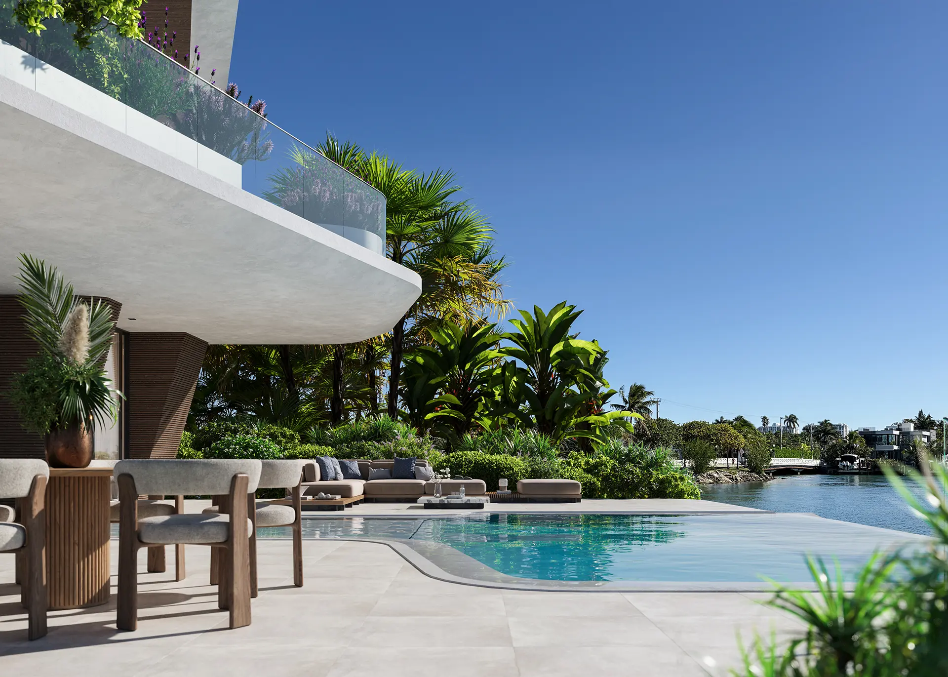 Poolside terrace with outdoor dining and lounge seating, overlooking the waterway through dense tropical greenery