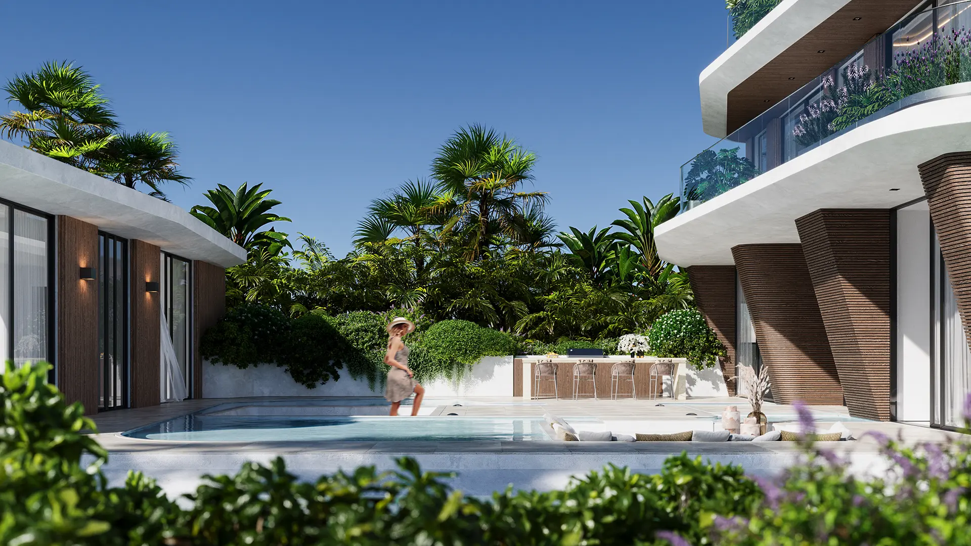 Courtyard pool, lush tropical landscaping, an outdoor kitchen bar, and curved architecture framing the space
