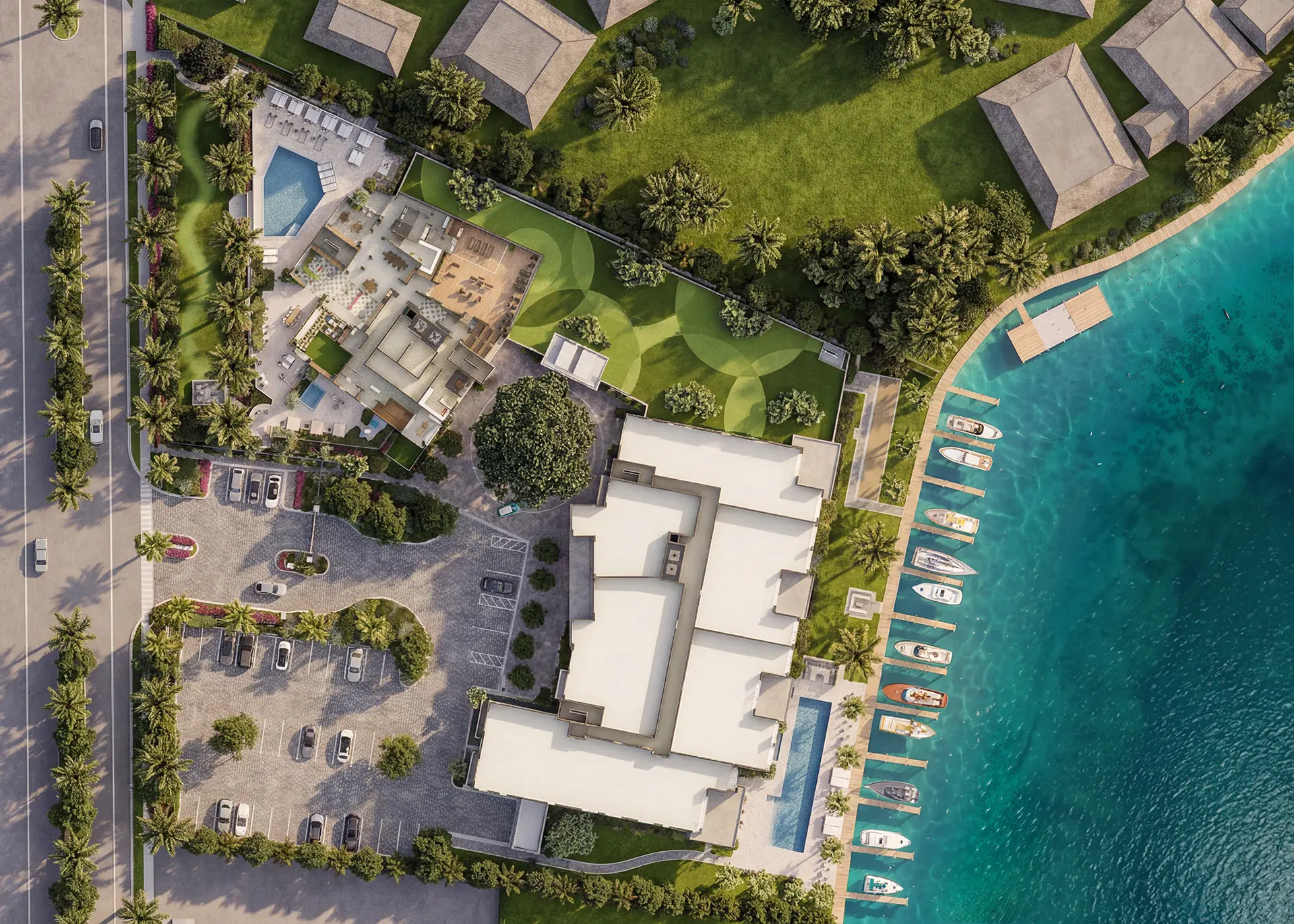 Aerial rendering of a beachfront resort with terracotta-roofed buildings, palm-lined drives, pool, and direct access to turquoise water.