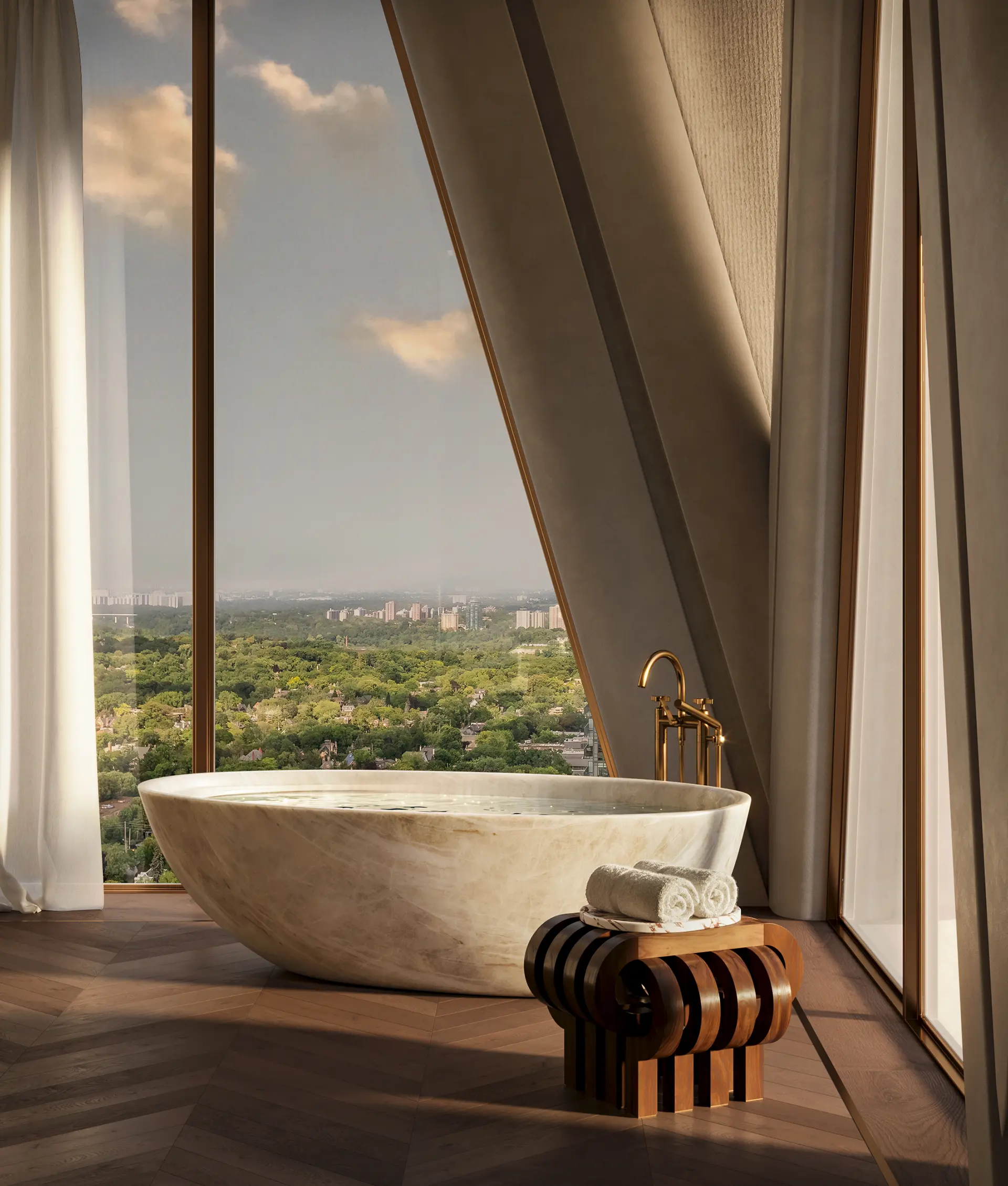 Freestanding oval marble bathtub positioned before floor-to-ceiling angled windows overlooking a green cityscape.