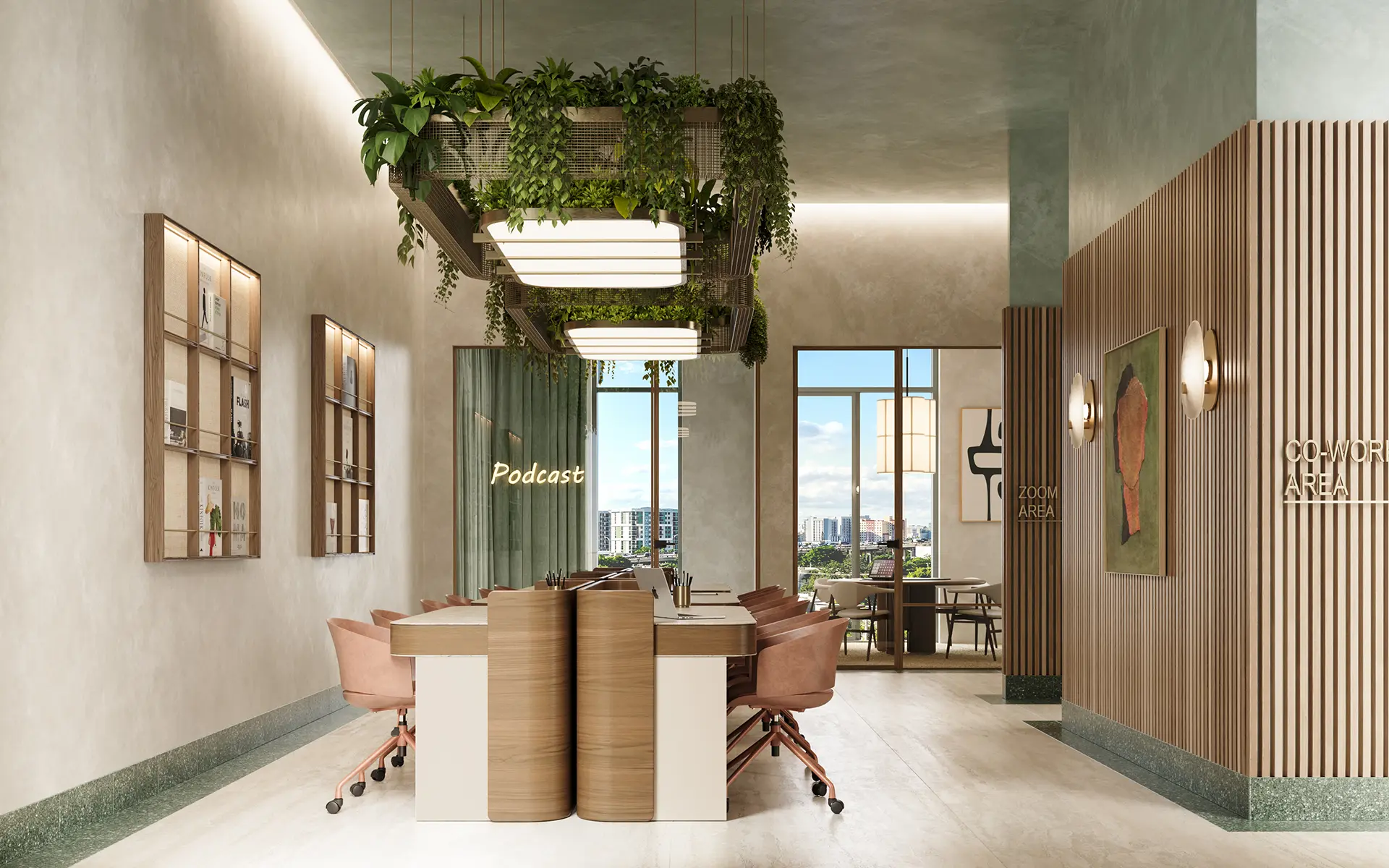 Co-working lounge with a shared wooden desk, pink chairs, hanging plant installation, and dedicated podcast and zoom areas.