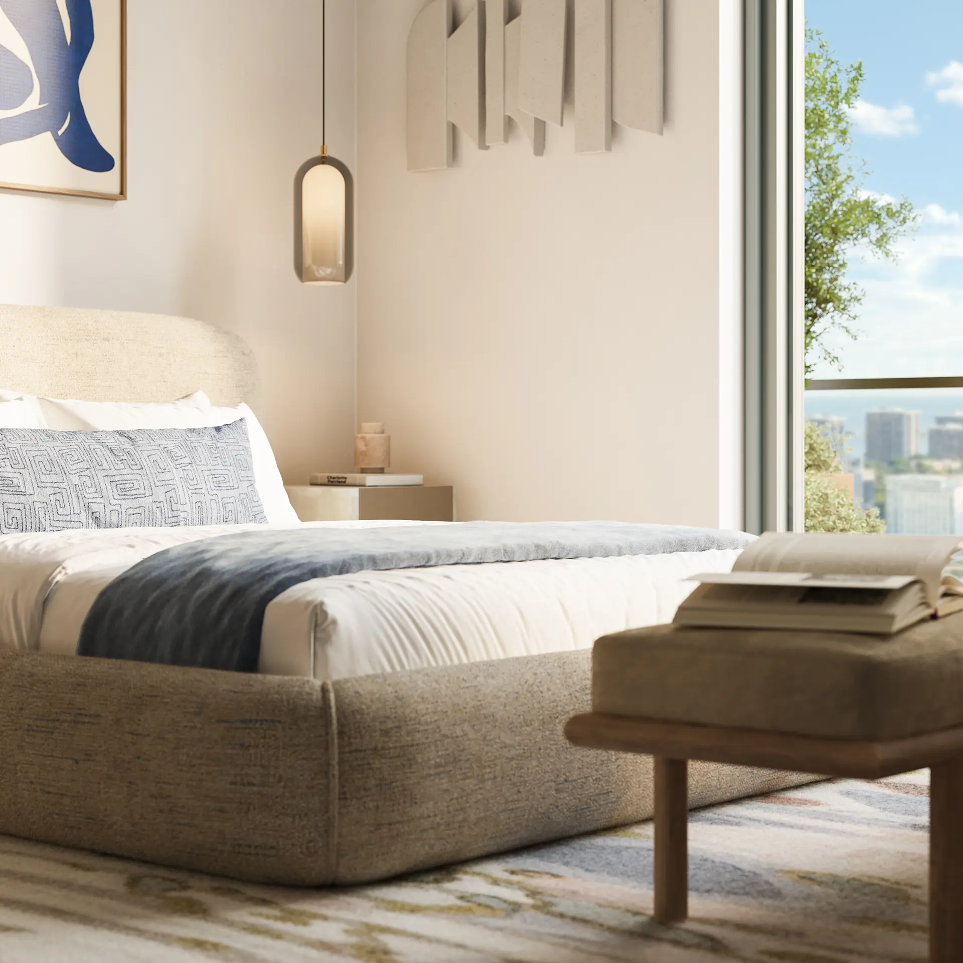Modern beige upholstered bed with white and gray bedding near a large window overlooking city buildings.