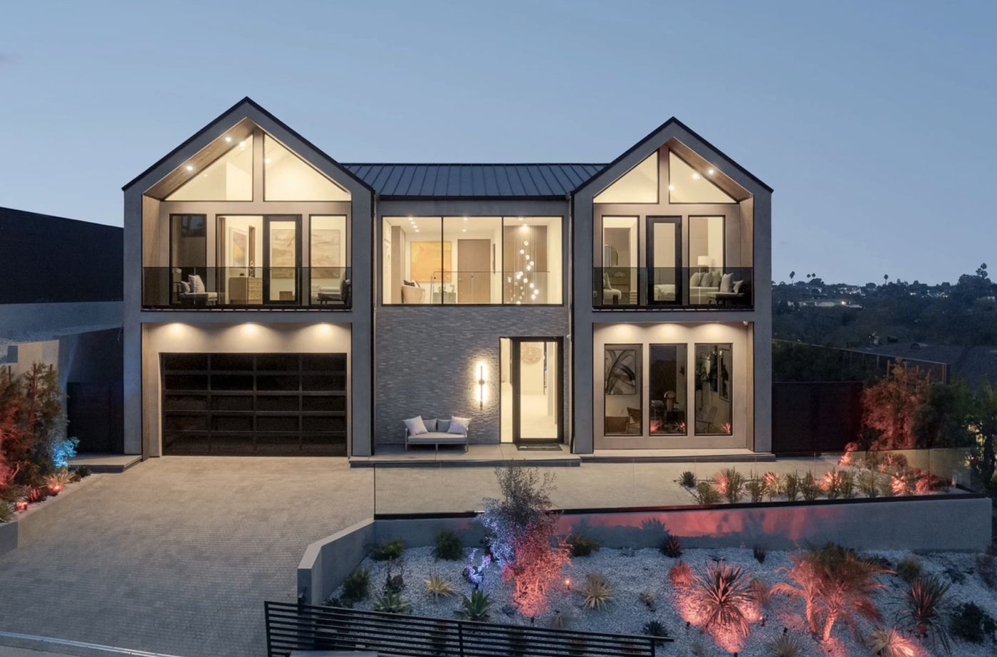 Modern custom home in Cheviot Hills at dusk — clean facade with no visible HVAC equipment