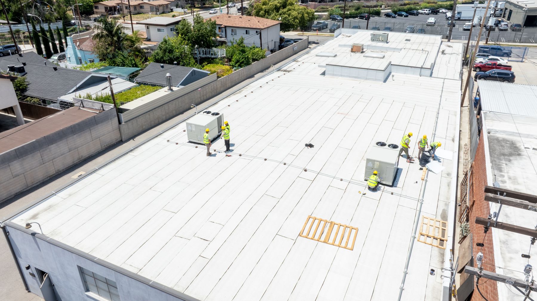 Rhino Air crews installing rooftop HVAC systems across a Burbank commercial roof — mechanical subcontractor at work