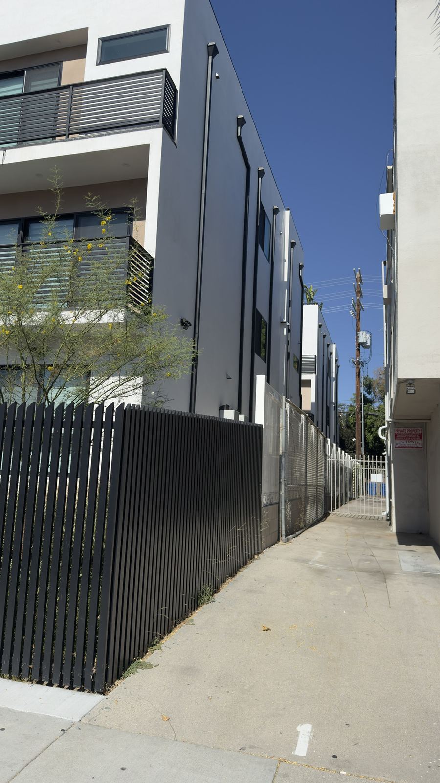 Side setback of a small-lot multifamily building in Valley Village — mechanical systems fitted to a tight footprint by Rhino Air