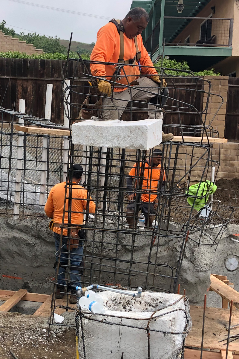 Men working on an iron structure.