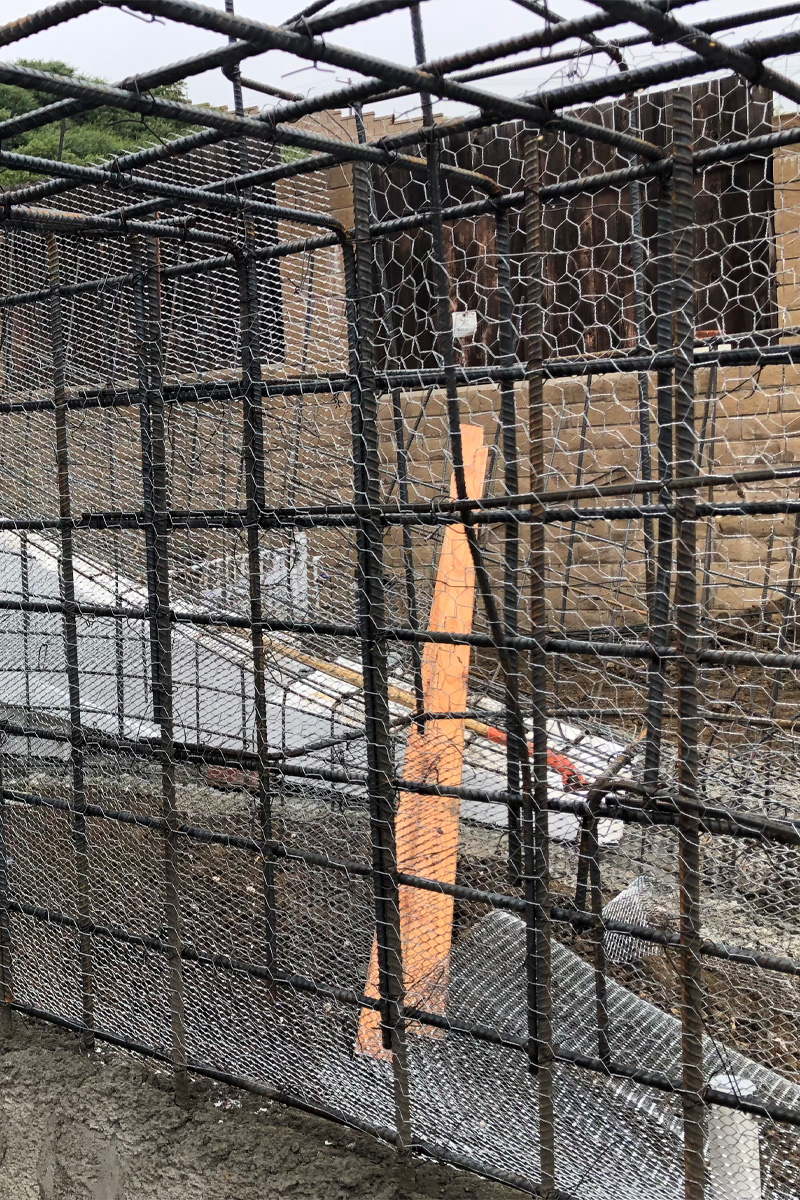 A structure composed of iron bars and wire mesh.