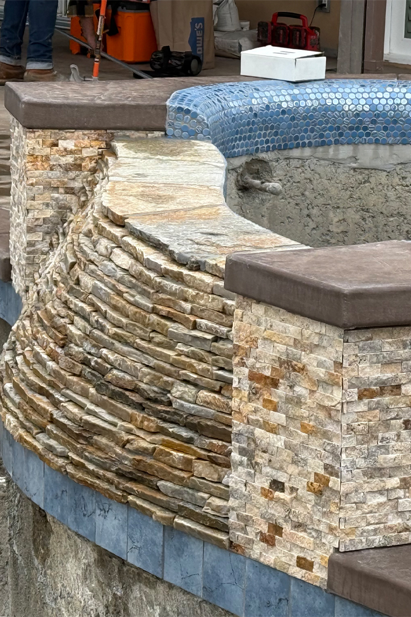 Details of tiles in various earth tones, such as browns, tans, and beiges. and blue