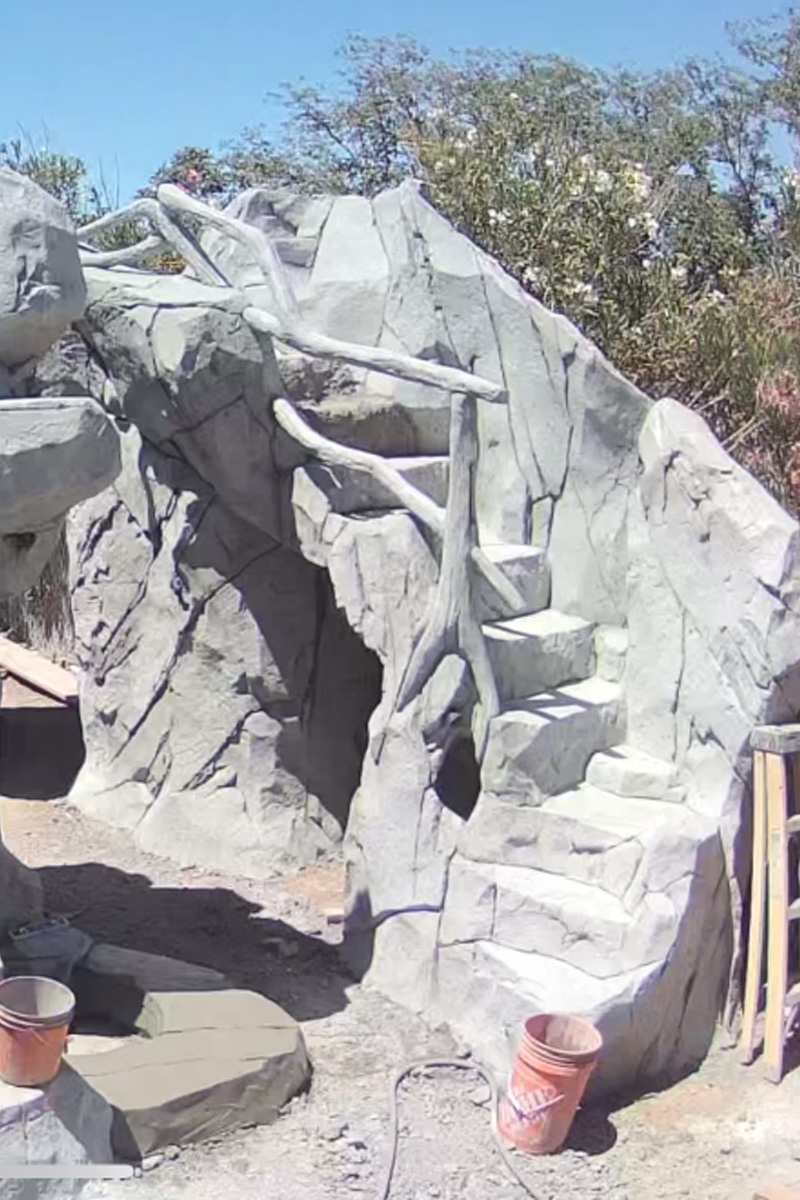 Stairs made of grey cement, currently in the process of construction.