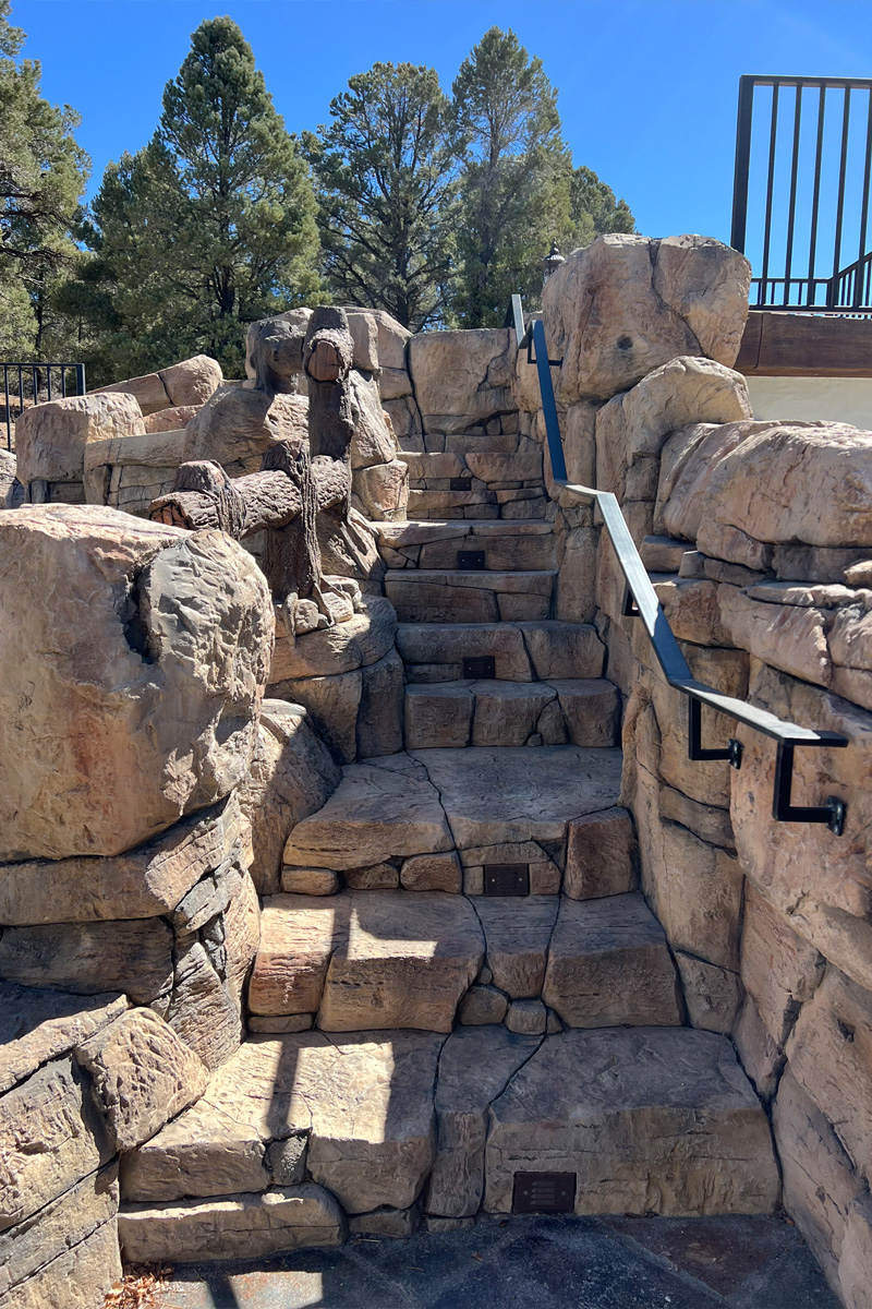 Stone steps that are perfectly integrated and firmly set into their surrounding environment, creating a seamless and sturdy pathway.