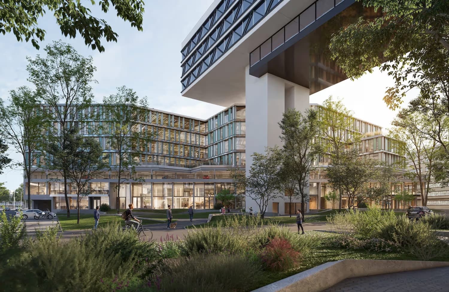 Modern office building with large glass windows, surrounded by trees and people walking and biking.