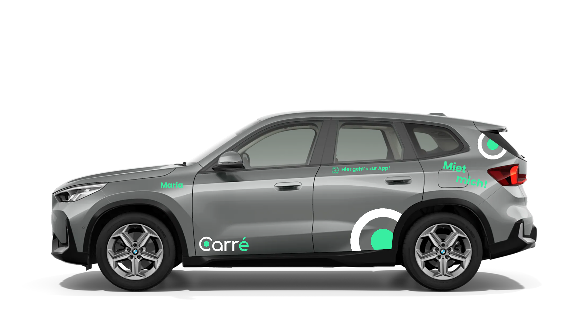 Side view of grey BMW SUV branded with green and white rental company decals and text.