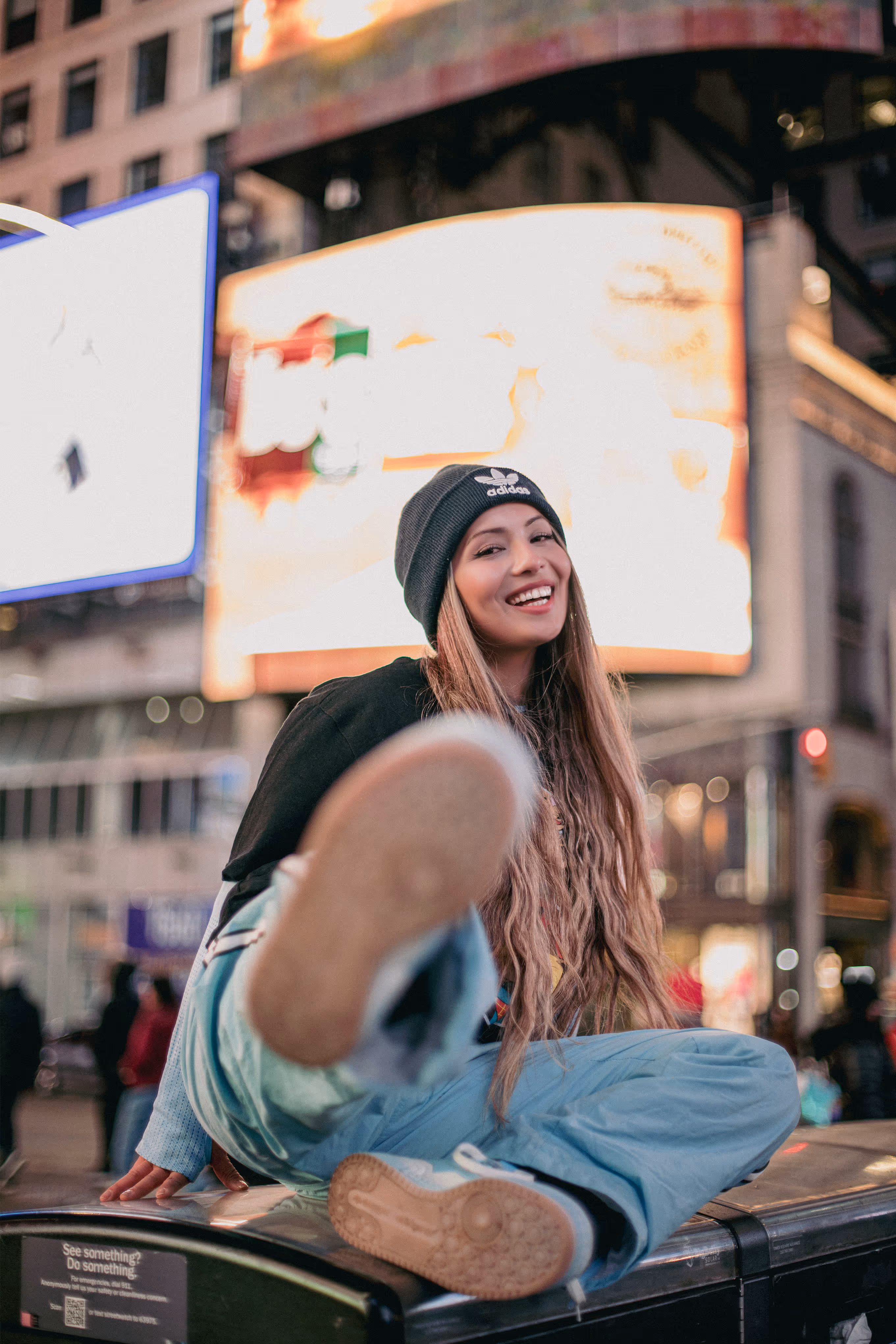 Model posing in the times square at night