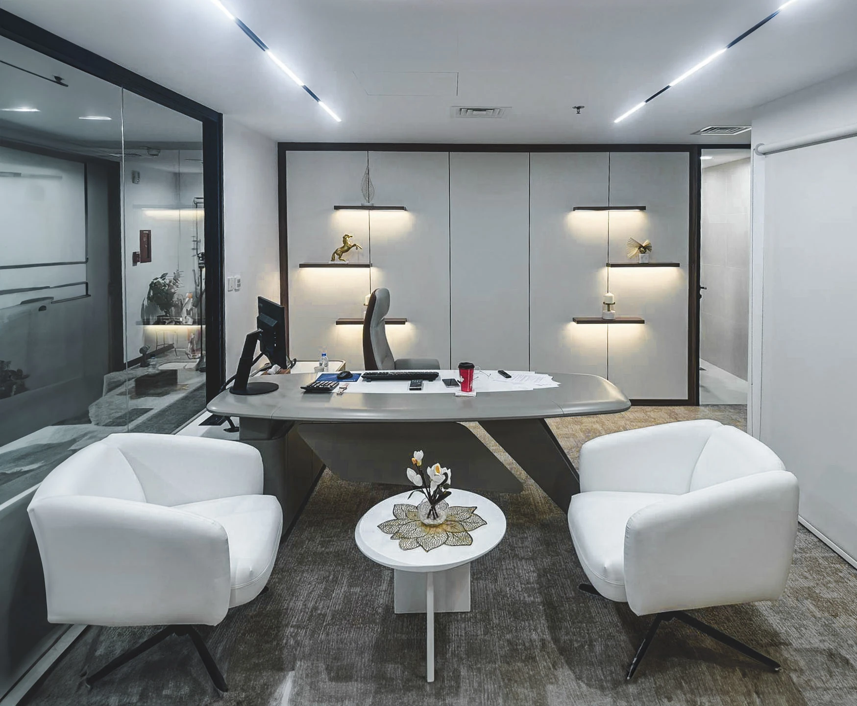 Massoun Insurance office with curved desk and white lounge chairs, West Bay, Doha, by Daya
