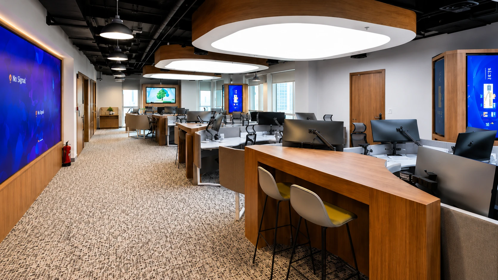Cyber Security Office workspace with standing desk counter and rounded ceiling light panels, Lusail Manarat, by Daya