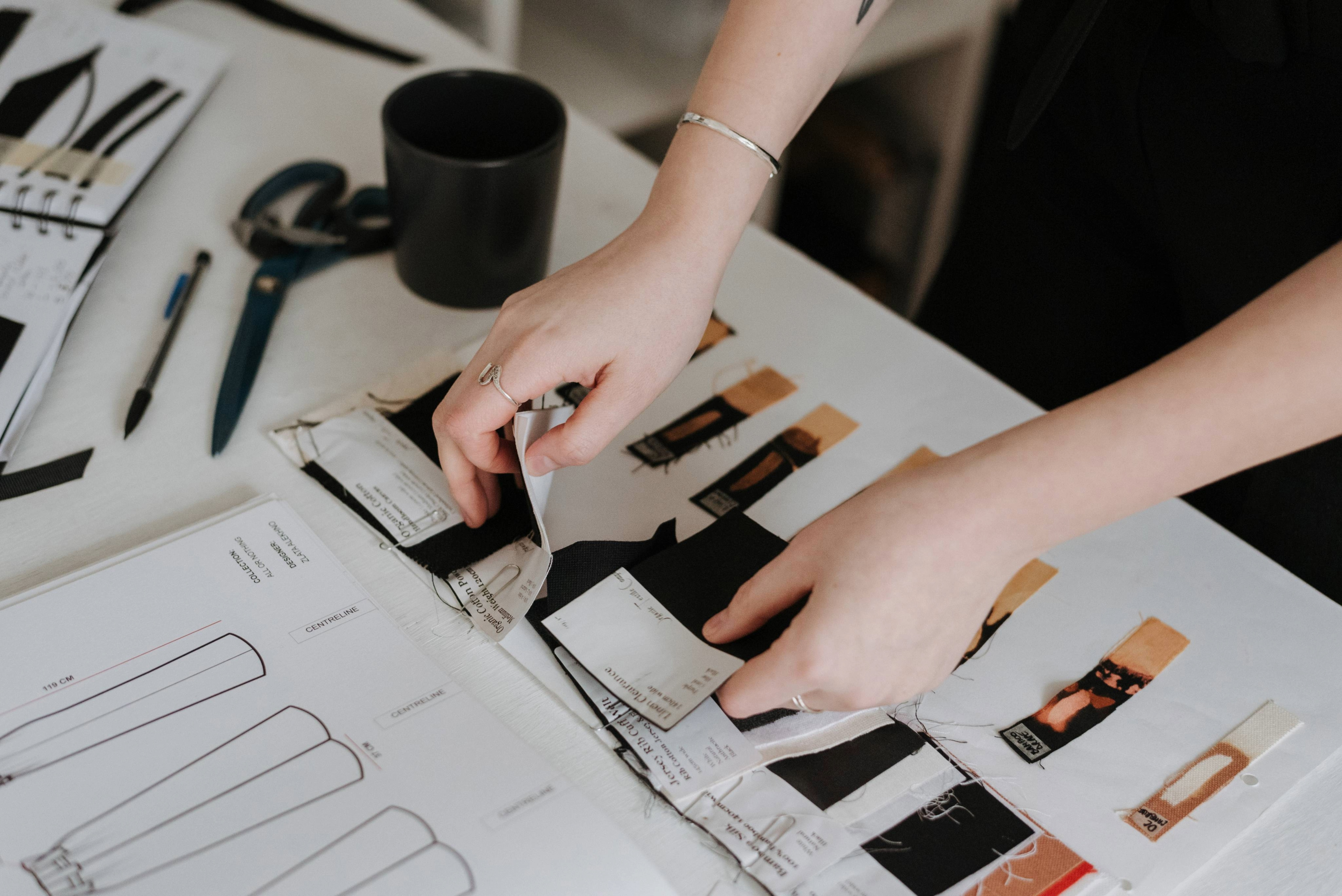 hands holding fabric samples