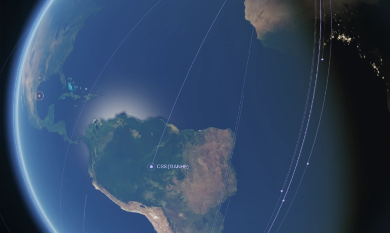 Still of the interactive Earth from the IGW homepage: the sunlit hemisphere over the Americas with the day–night terminator, launch-site markers and station orbit tracks, captured 3 September 2026.