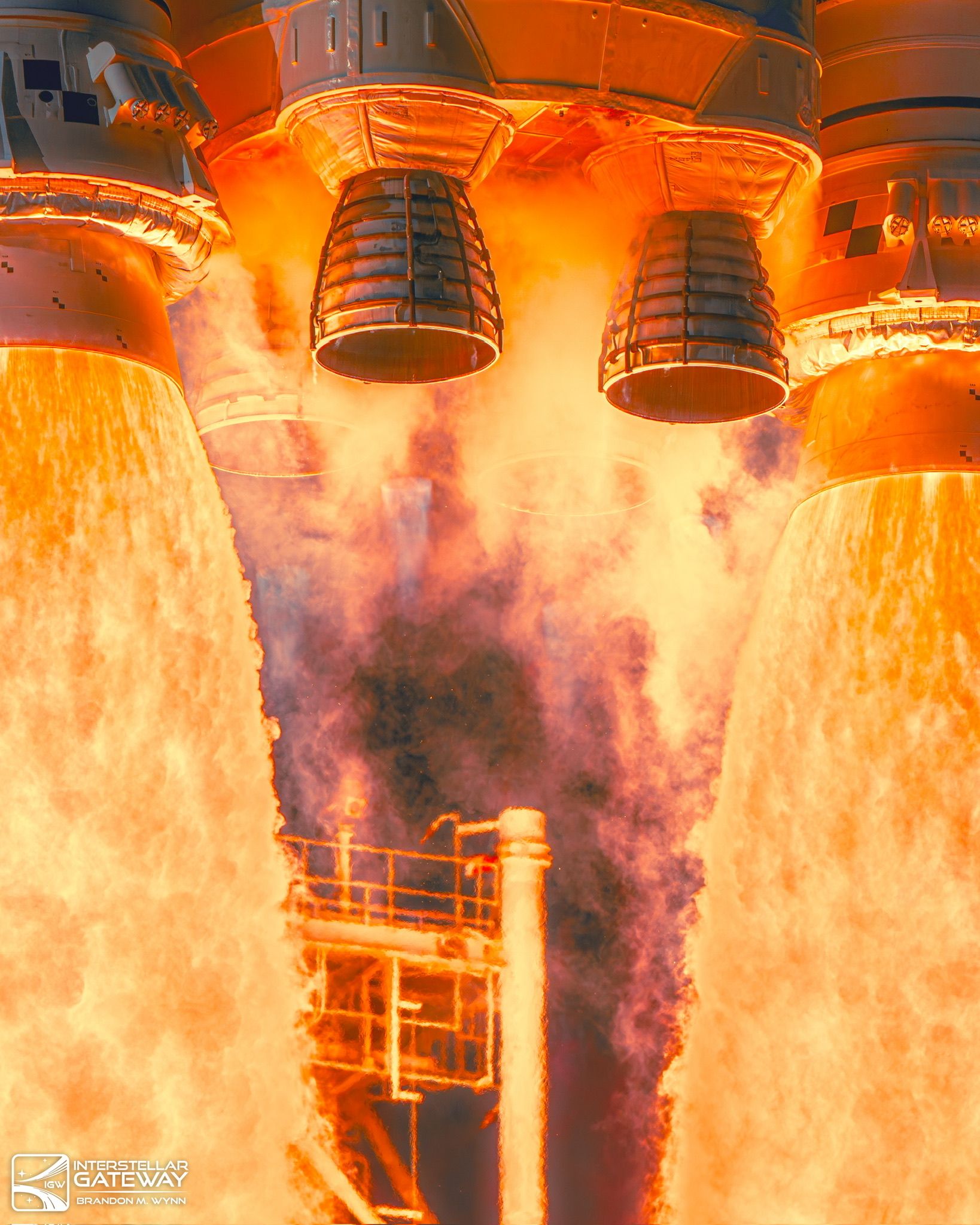 The Space Launch System's core stage engines and booster nozzles at ignition, close in.