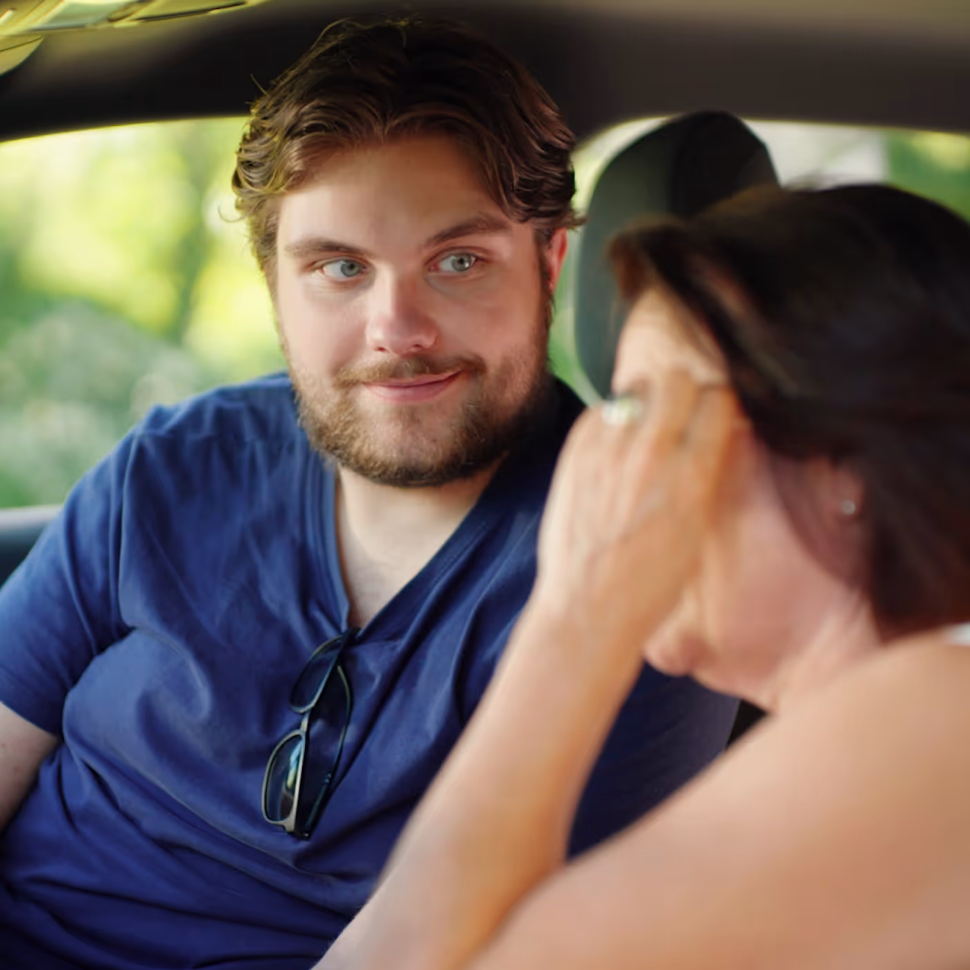 Man and woman sitting in car