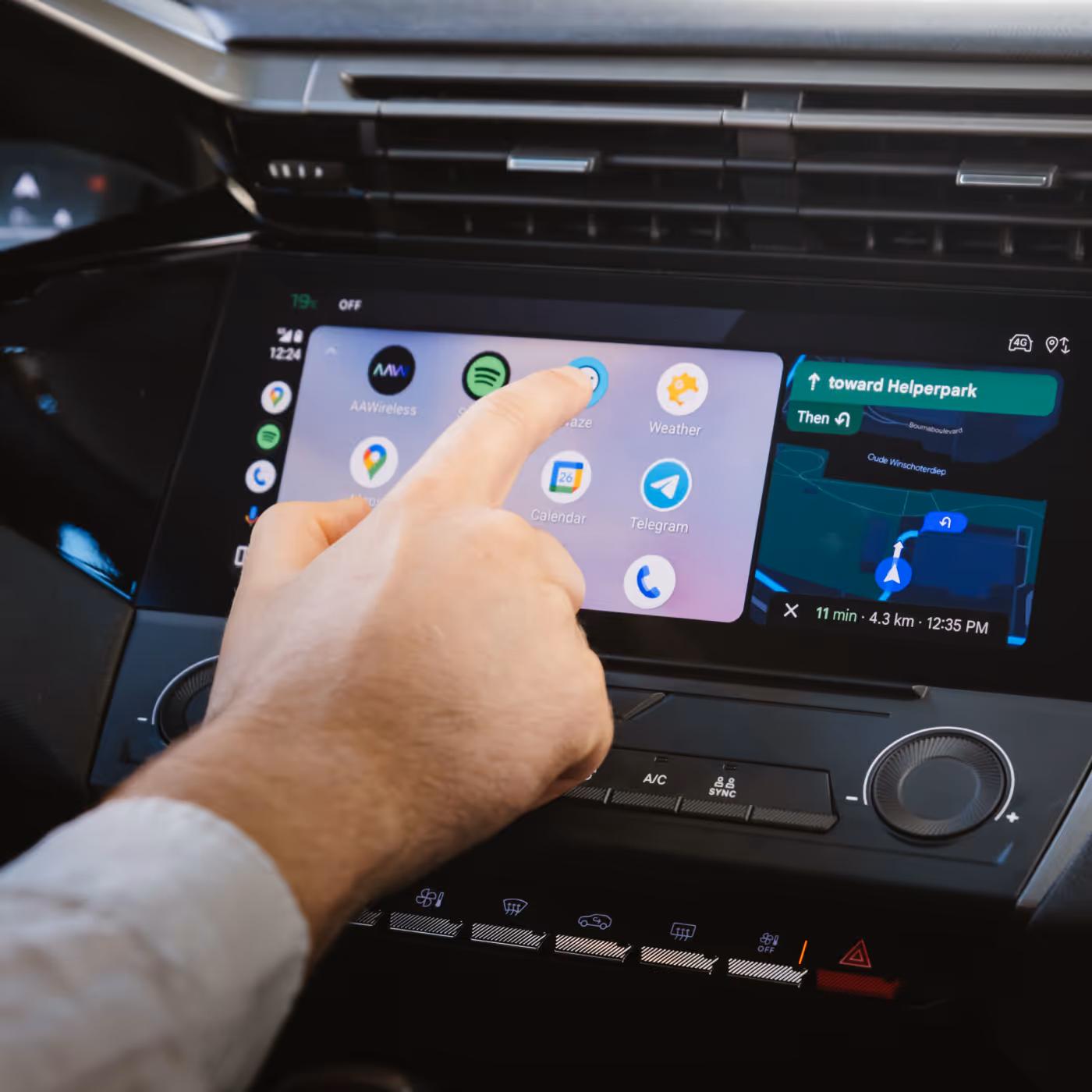 Finger touching head unit screen
