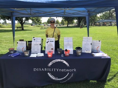 DNEM staff member hosts mobile outreach event in a community park.