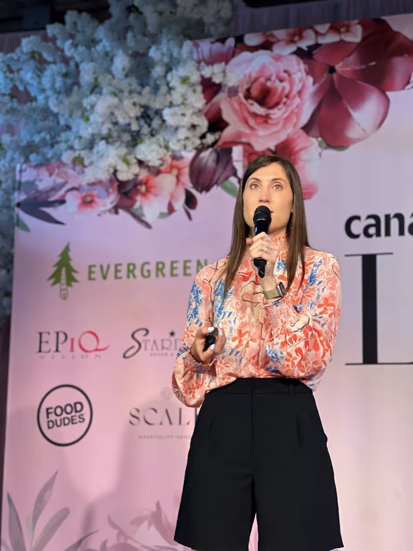 Head huntress talking on stage