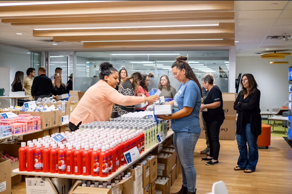 Volunteers helping hand out products