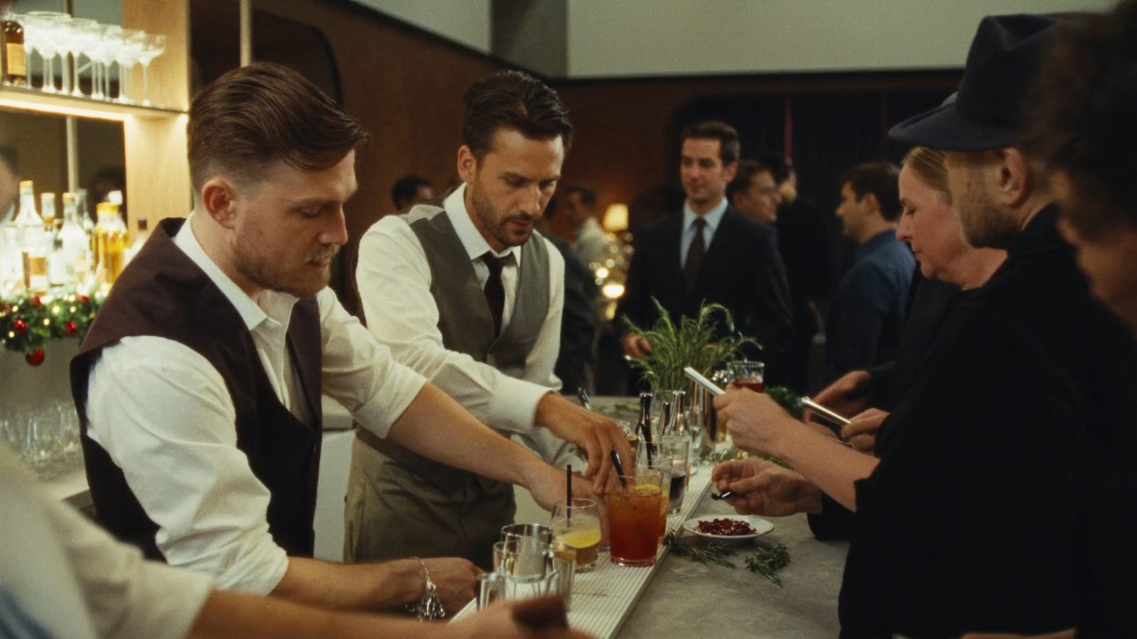 Bartenders making signature holiday cocktails at a corporate party bar