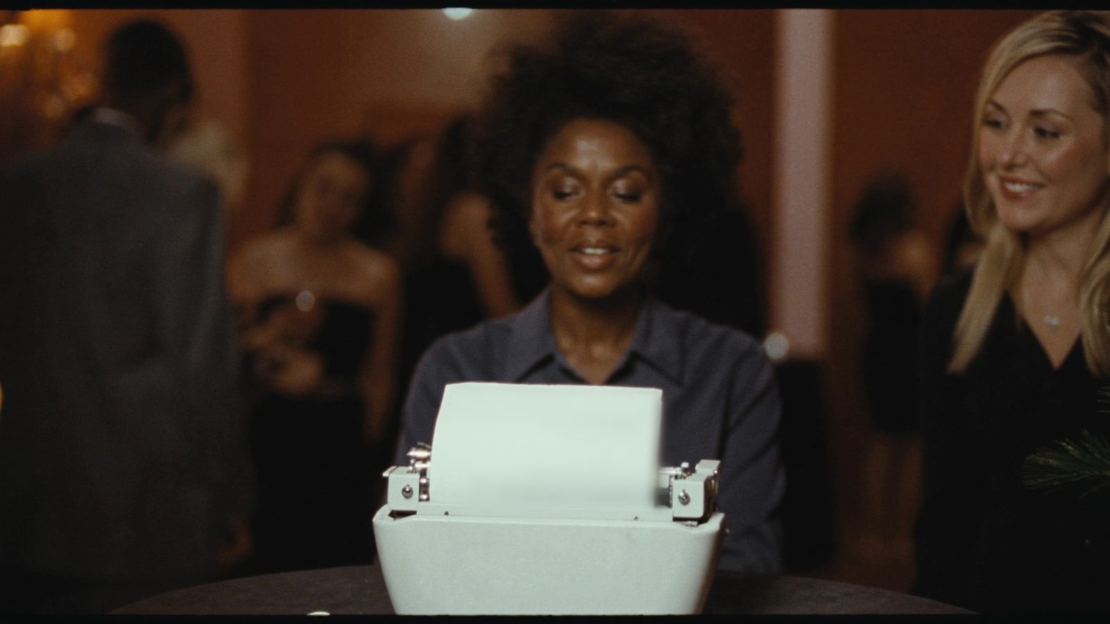 Poet typing a custom poem for a guest on a vintage typewriter