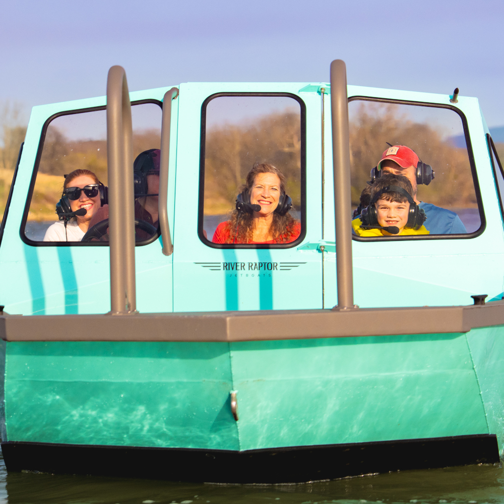 A young boy on a boat ride with Smoky Mountain Jet Boat.
