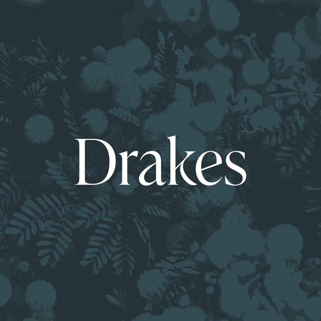 Drakes logo on a blue floral background.