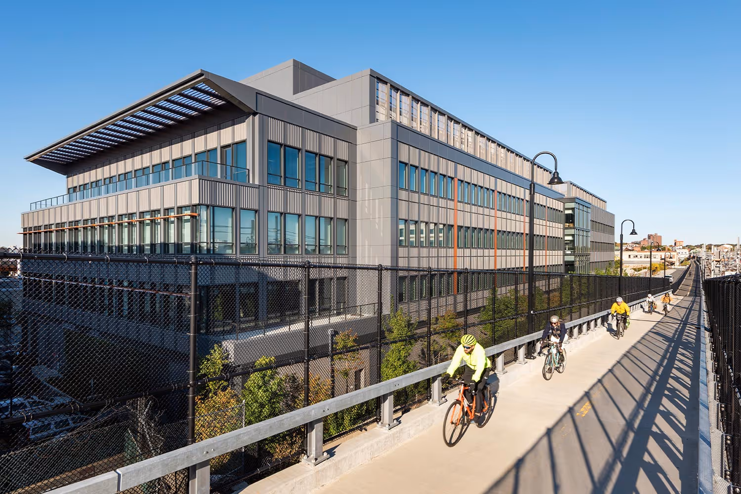 Open-plan biotech coworking space at Hatch.Bio Labs with height-adjustable desks and natural light for scientific teams