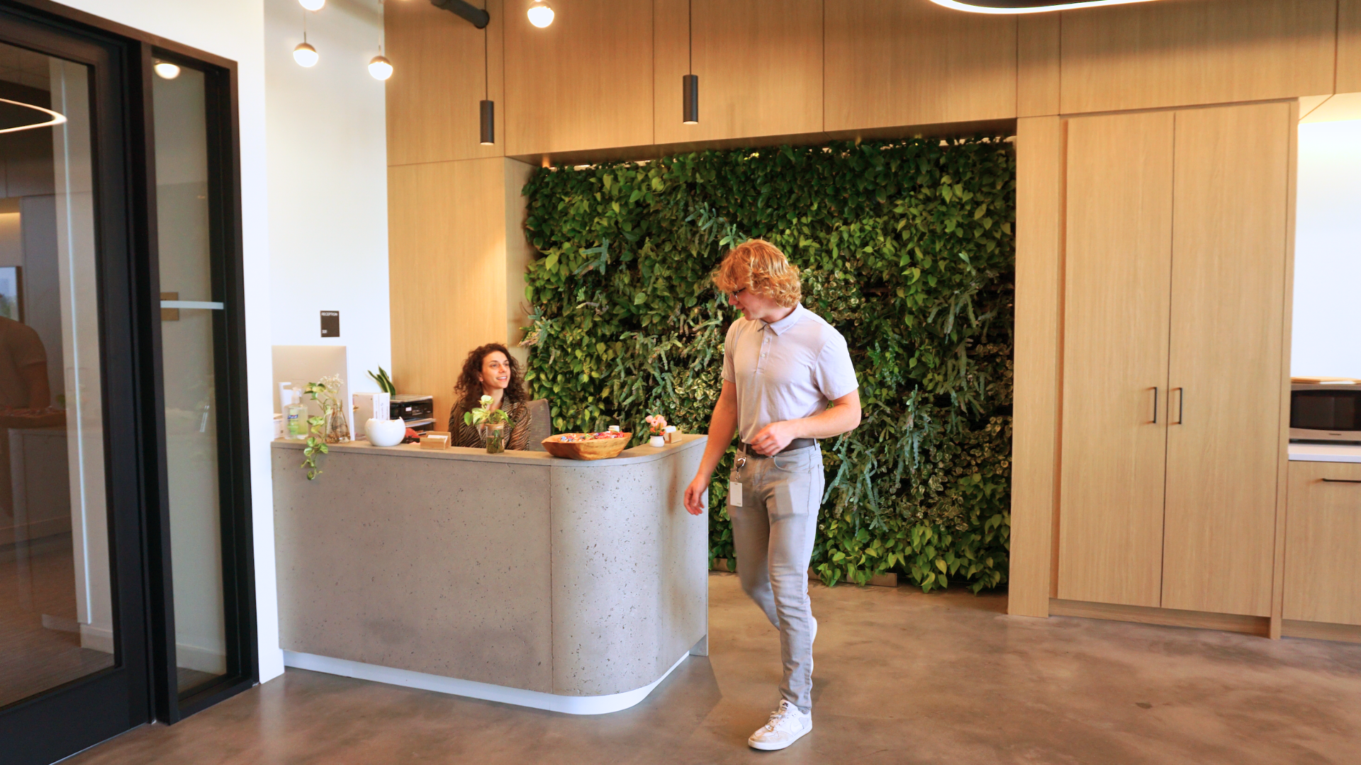 Lobby with vertical living plant wall and on-site administrator providing 24/7 access and lab security