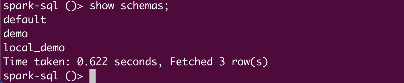 Terminal output showing Spark SQL command show schemas; listing three schemas: default, demo, and local_demo, with execution time and rows fetched.