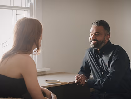 Hair transplant specialist consulting with a female patient about hair restoration treatment options.