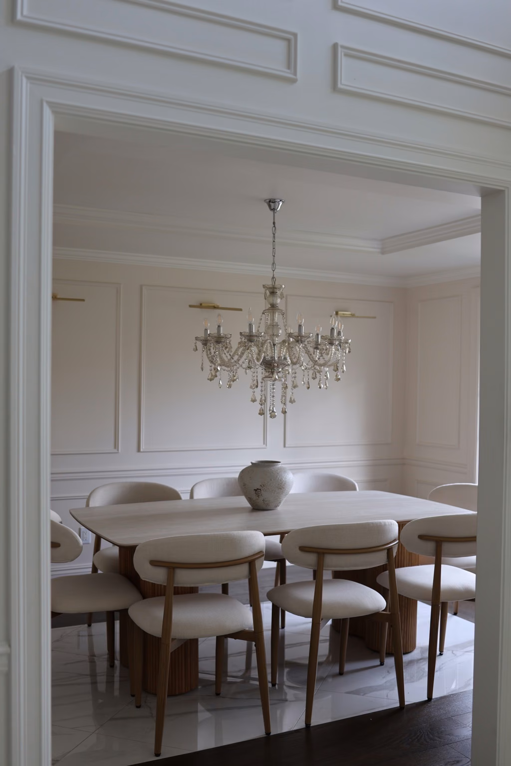 Finished dining room with white wall detailing