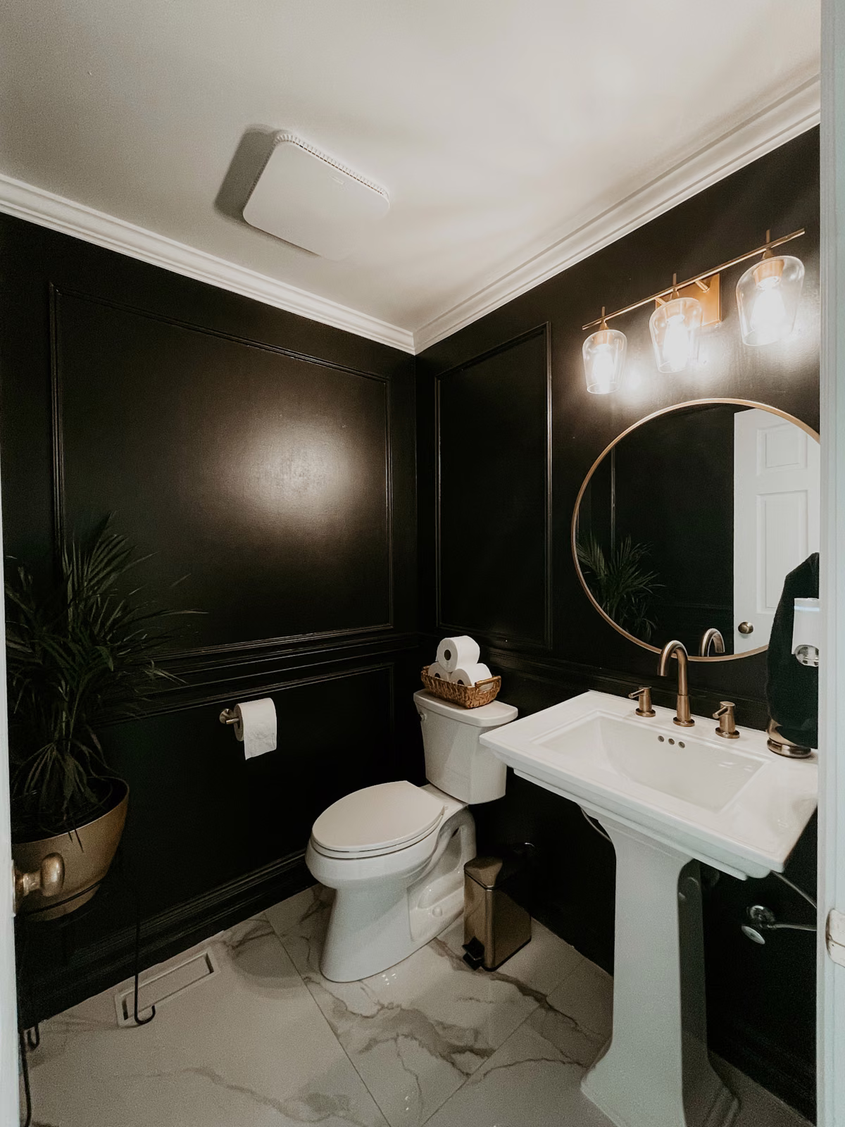 Same Bellevue powder room finished with dark walls, vanity and light floor