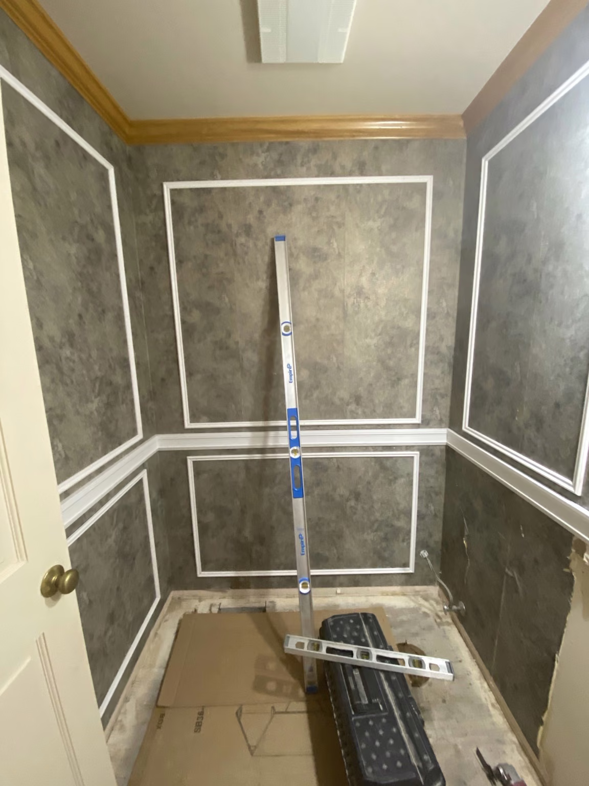Bellevue powder room during renovation with wall detailing in progress