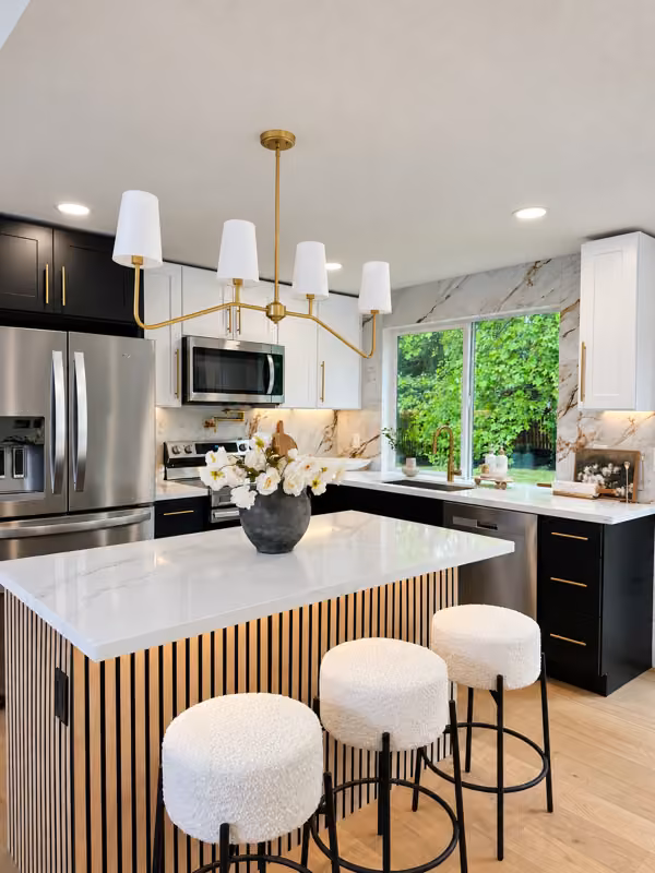 Issaquah remodeled kitchen with illuminated wood slat island, two-tone cabinetry and light veined counters