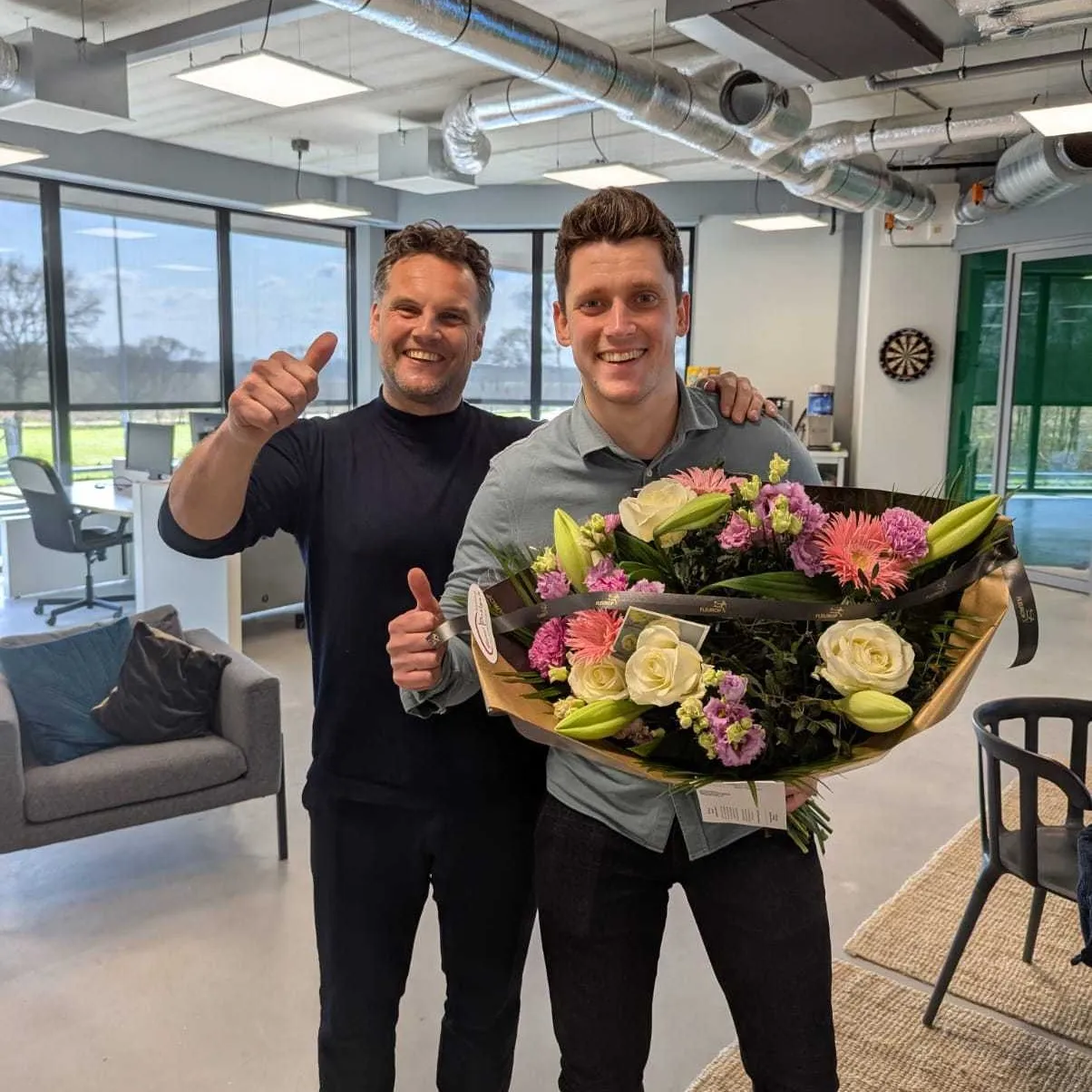 Koen and Mick with a bouqet of flowers