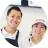 Smiling man and woman wearing white shirts and hats posing closely together.