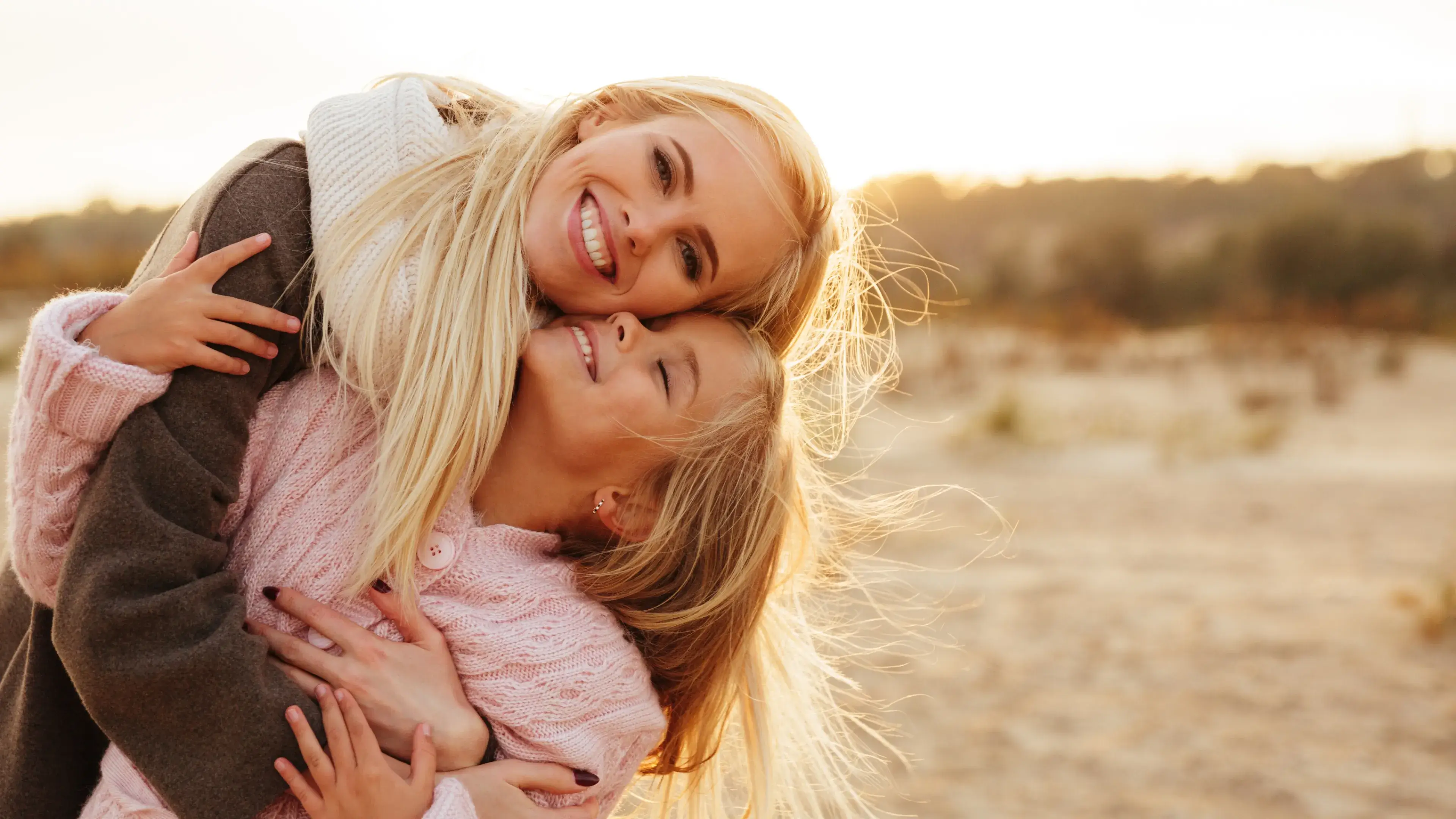 a couple of women that are hugging each other