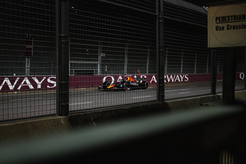A Formula 1 race car driving on a circuit, representing the return of F1 to Sepang International Circuit Malaysia in 2026