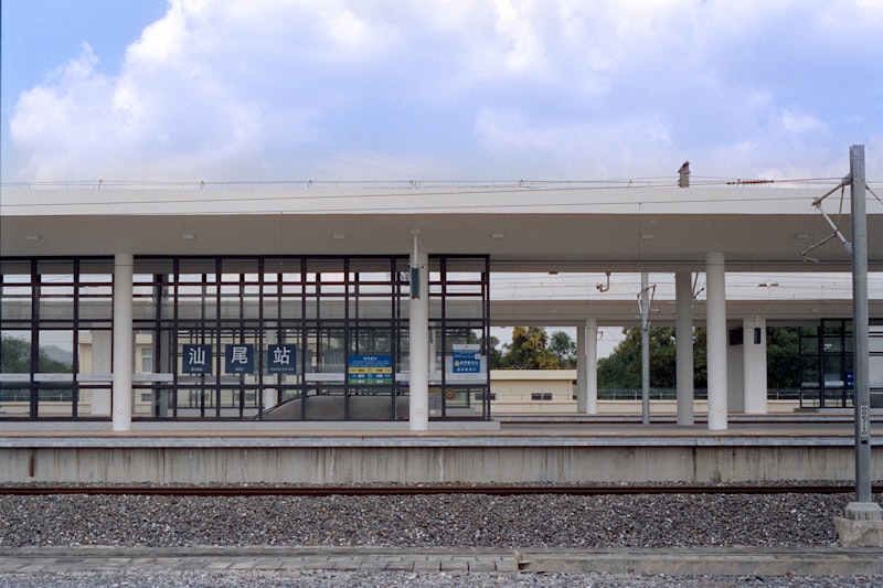 Modern train station platform with glass facade, representing the new RTS Link connecting Johor Bahru and Singapore