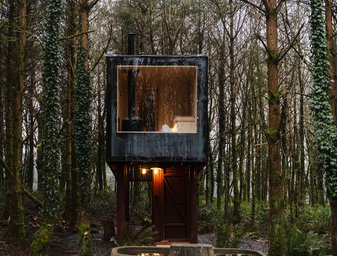 Sauna In The Woods front with sauna on and light on