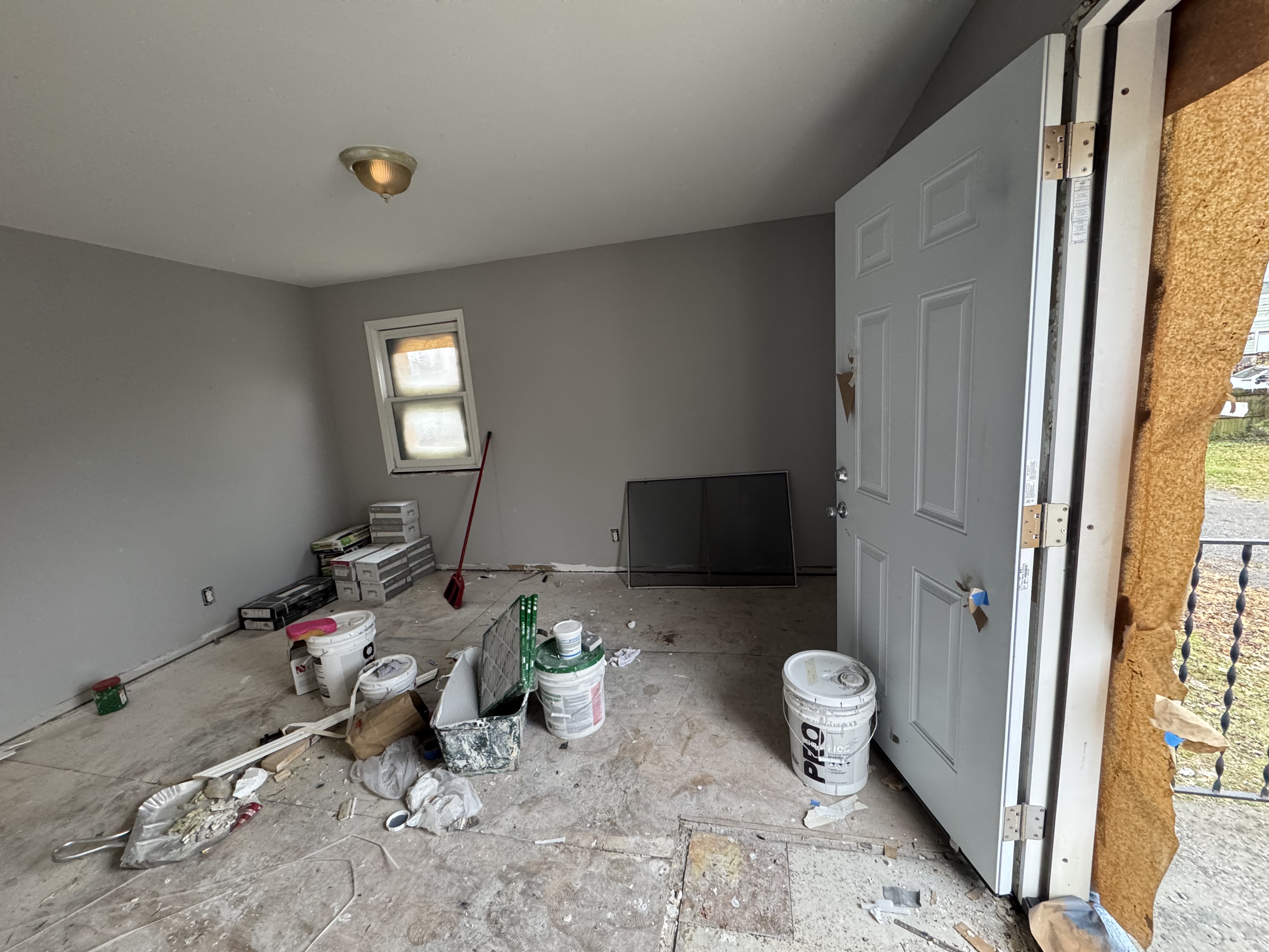 Interior of the duplex mid-renovation with new paint and flooring