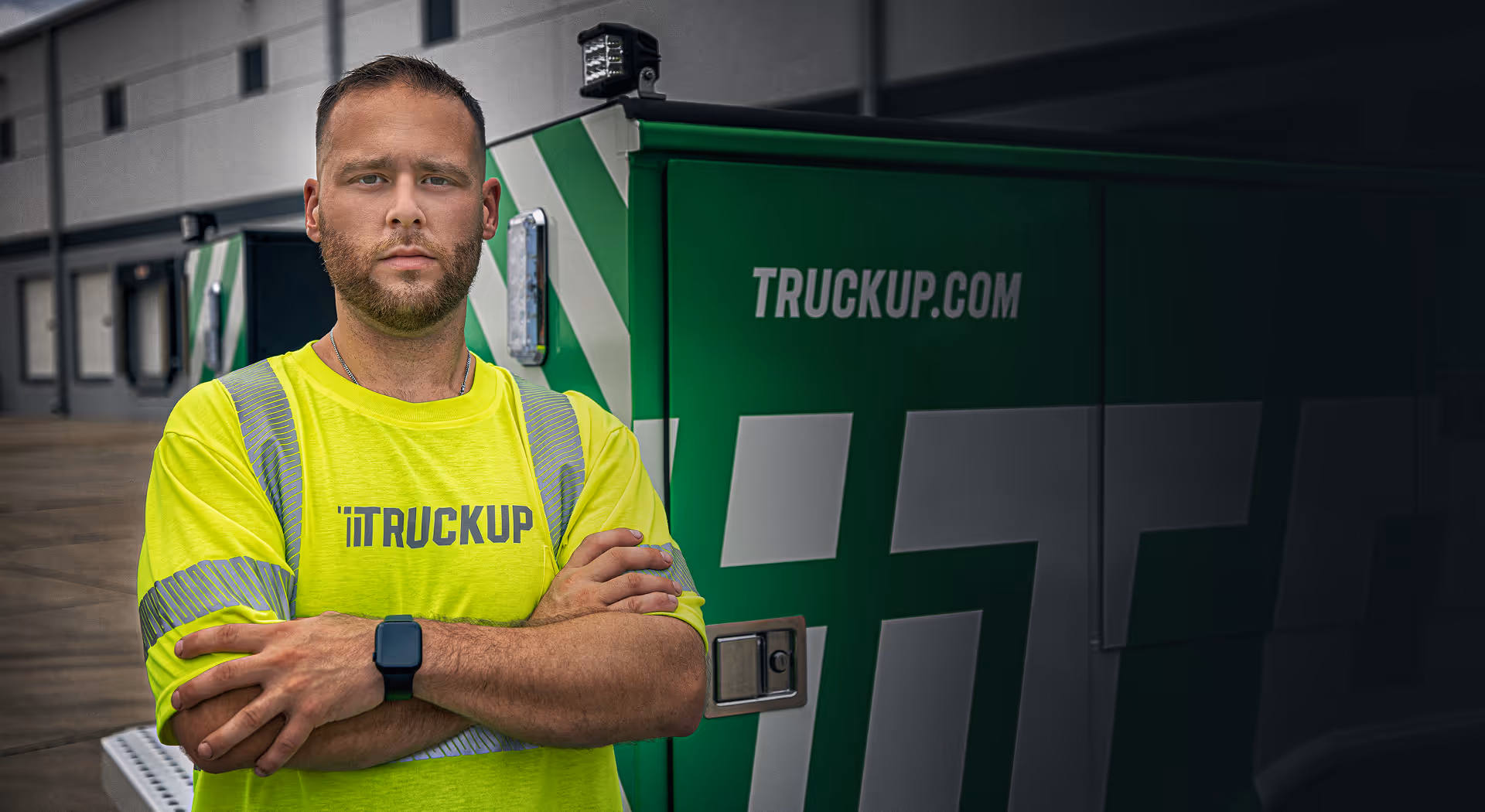Certified mechanic in a TruckUp high vision vest