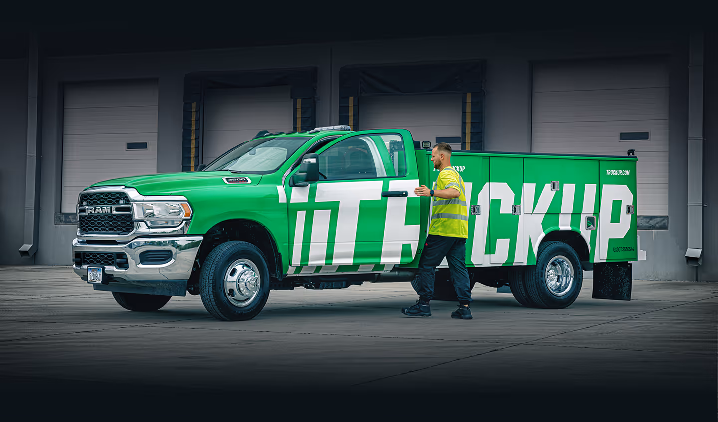 Professional truck driver entering Truckup vehicle for delivery job